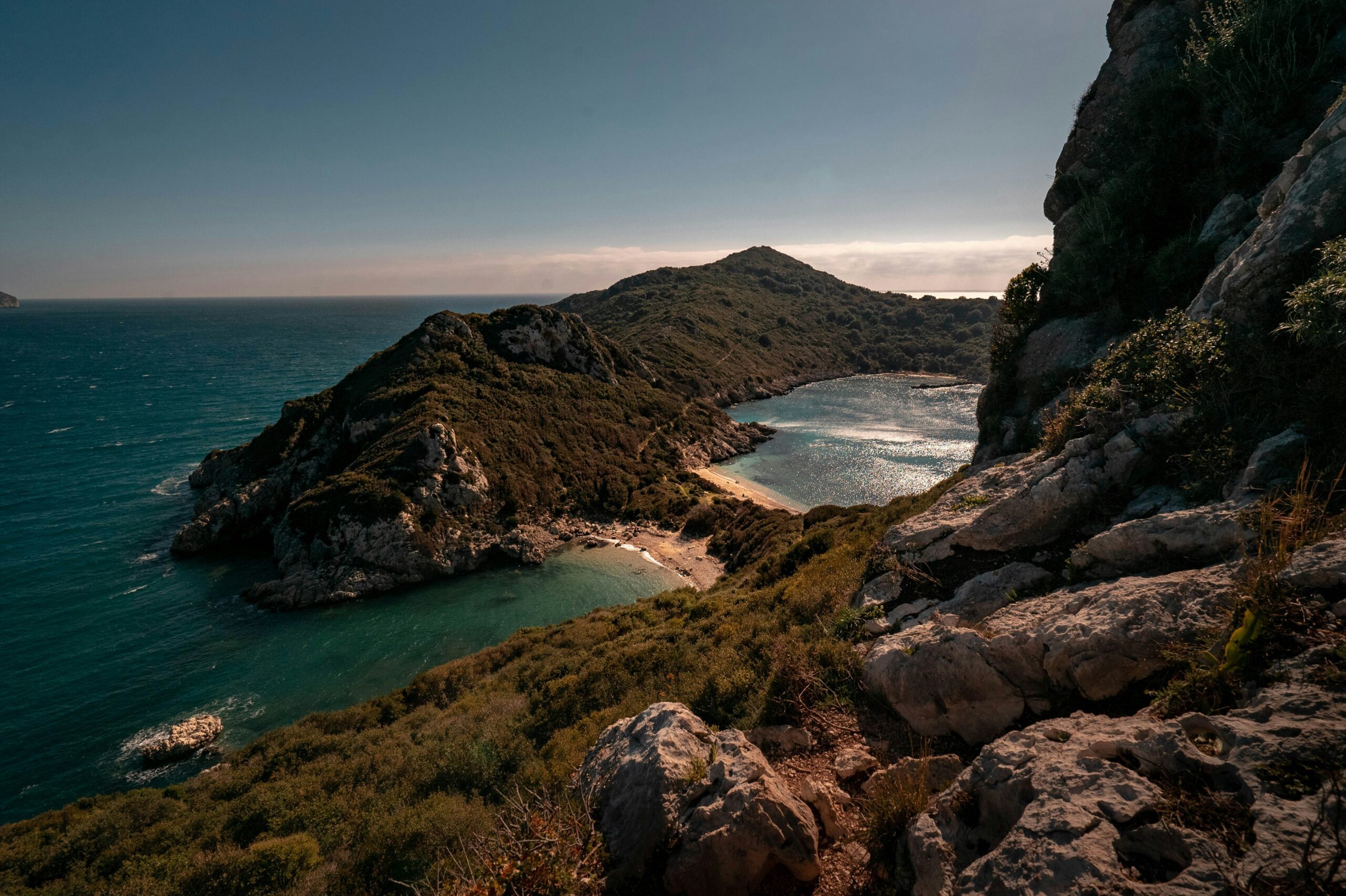 rock formations and sky over ocean waters