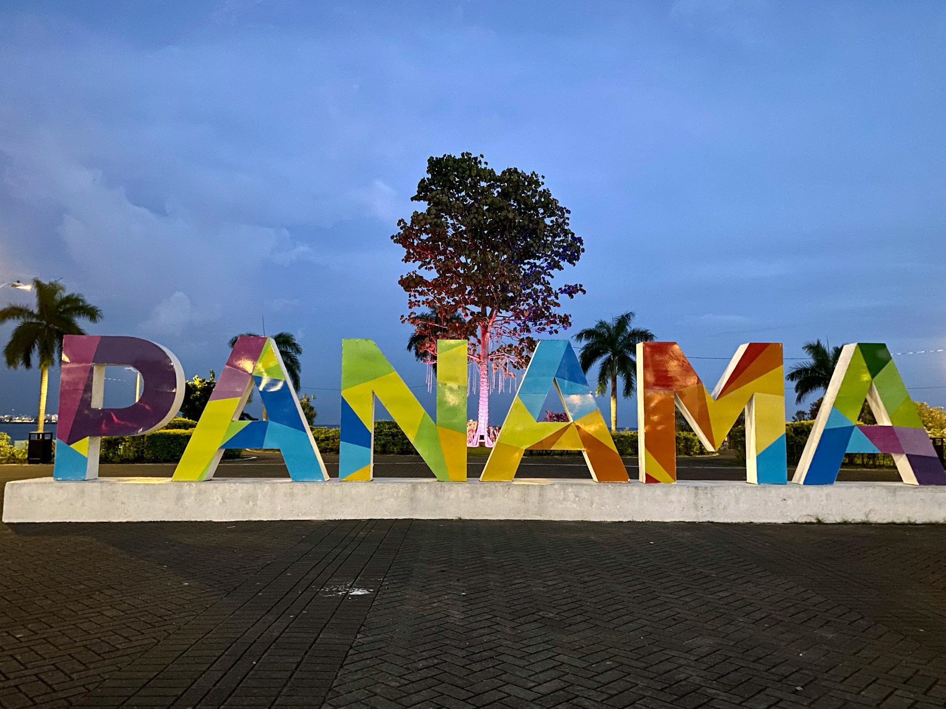 Colourful big block letters reading 'Panama', with blue skies behind.