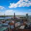 A view of Riga city filled with colourful buildings on the water's edge.