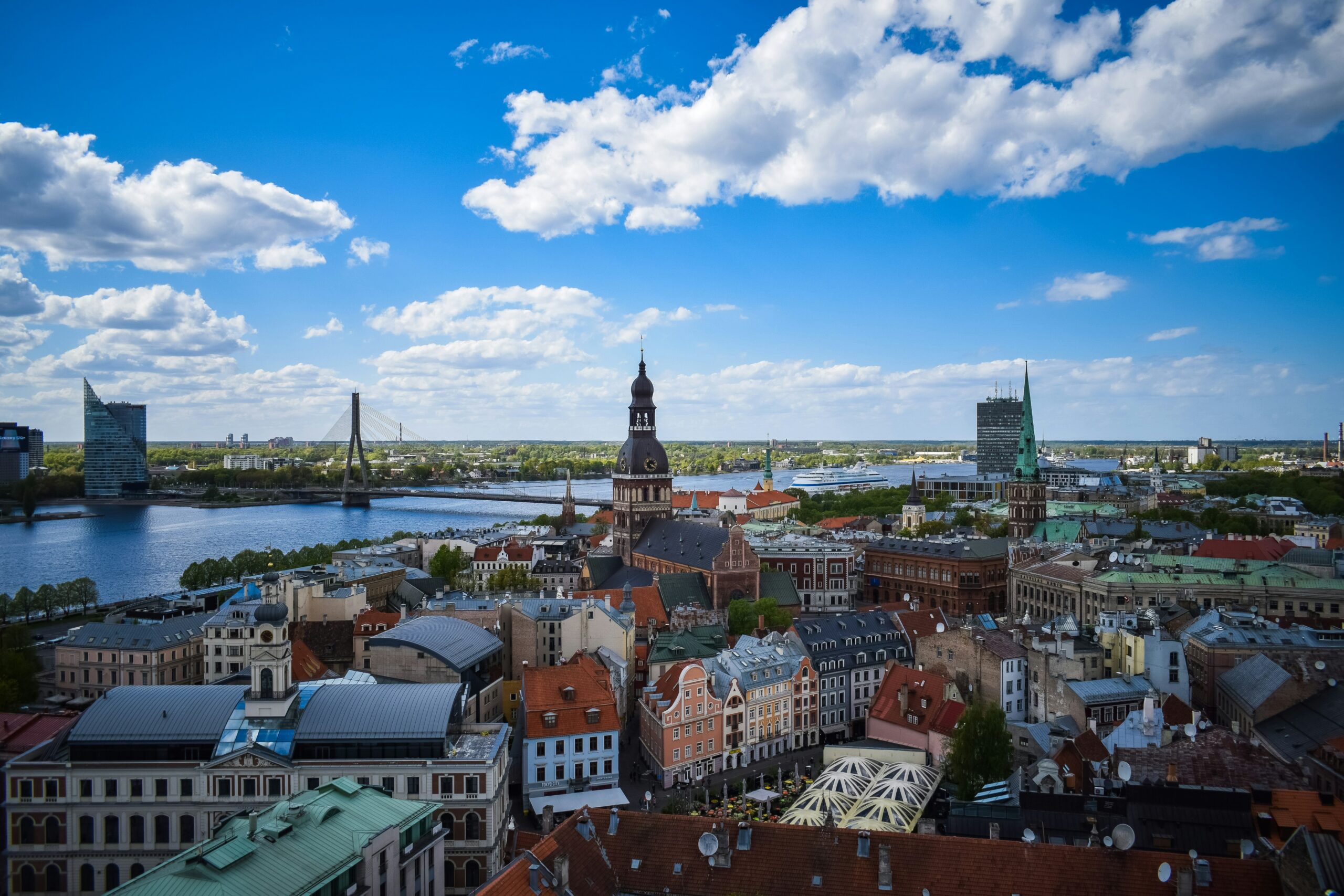 A view of Riga city filled with colourful buildings on the water's edge.
