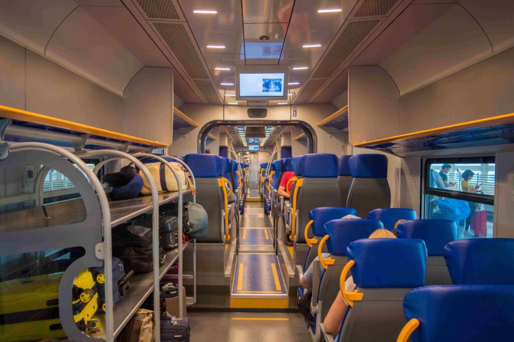 Inside of the Fl1 regional train at Rome FCO Airport.
