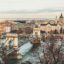 Scenic view of central Budapest featuring the iconic Chain Bridge over the Danube River, with historic buildings and St. Stephen's Basilica in the background—part of the route from Budapest Airport to the main train station.