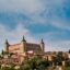 A large rectangular castle built on top of a hill in Toledo.