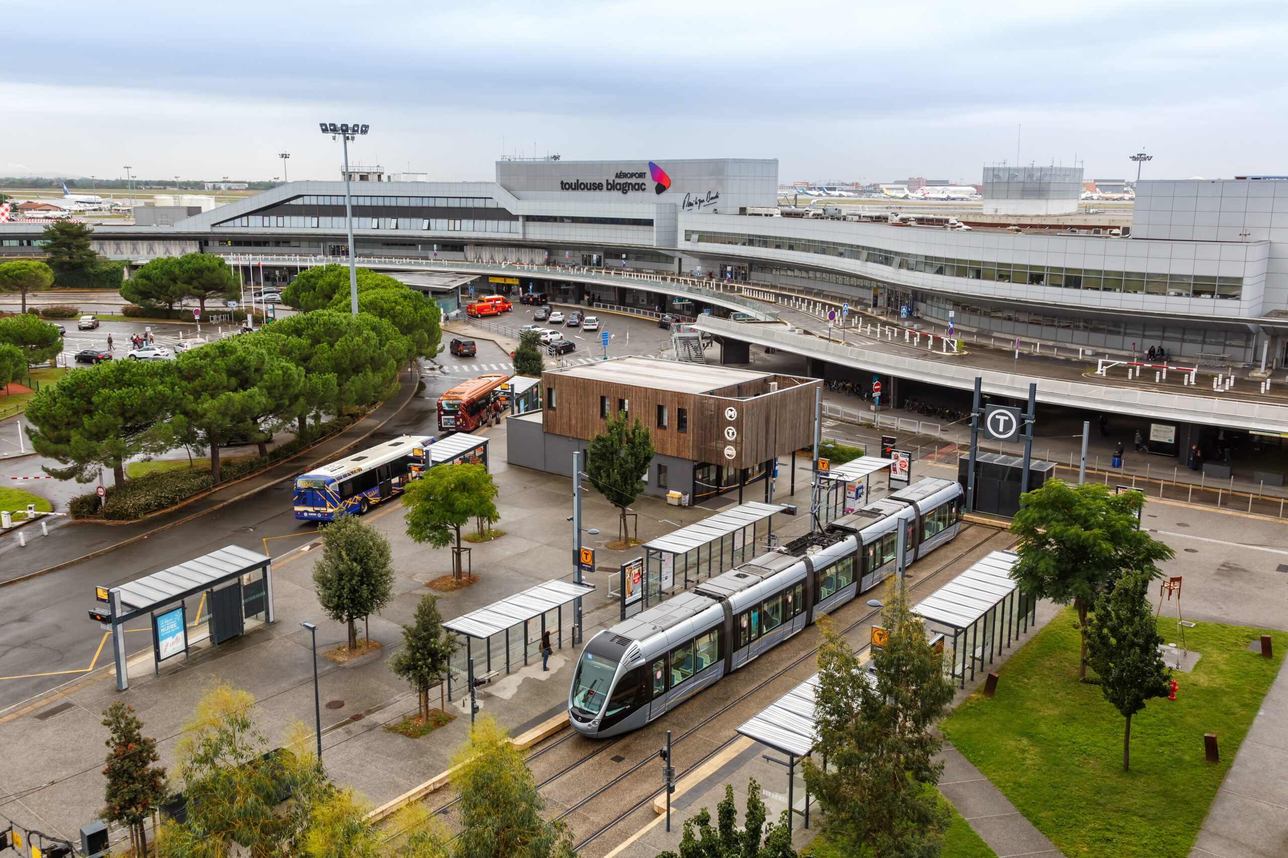 Toulouse, France - September 21, 2021: Modern light rail tram model Alstom Citadis public transport transit at Blagnac airport in Toulouse, France.