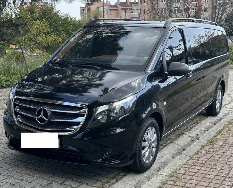 Istanbul Airport taxi - Welcome Pickups A black Mercedes large sedan parked on a quiet city street during the day, commonly used as an IST Airport taxi for comfortable transfers to and from Istanbul Airport.