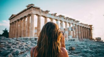 Tourist taking a photo of the Parthenon, Athens