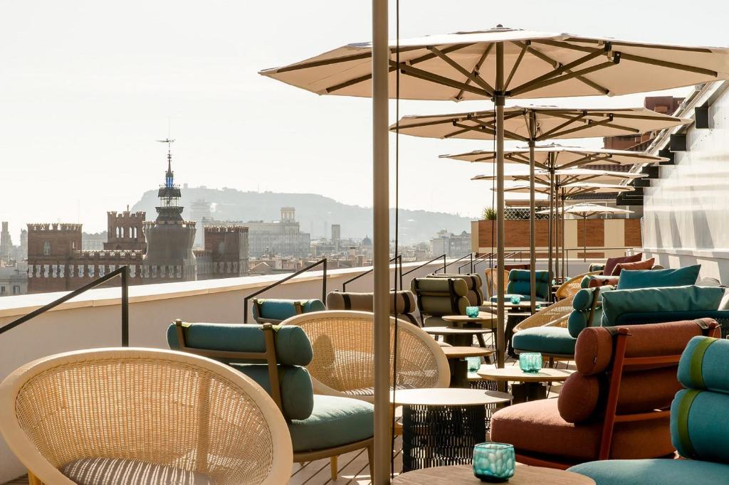 Outdoor seating on the patio of Motel One overlooking Barcelona city. 