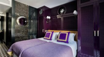 Purple themed room at Room Mate Anna,