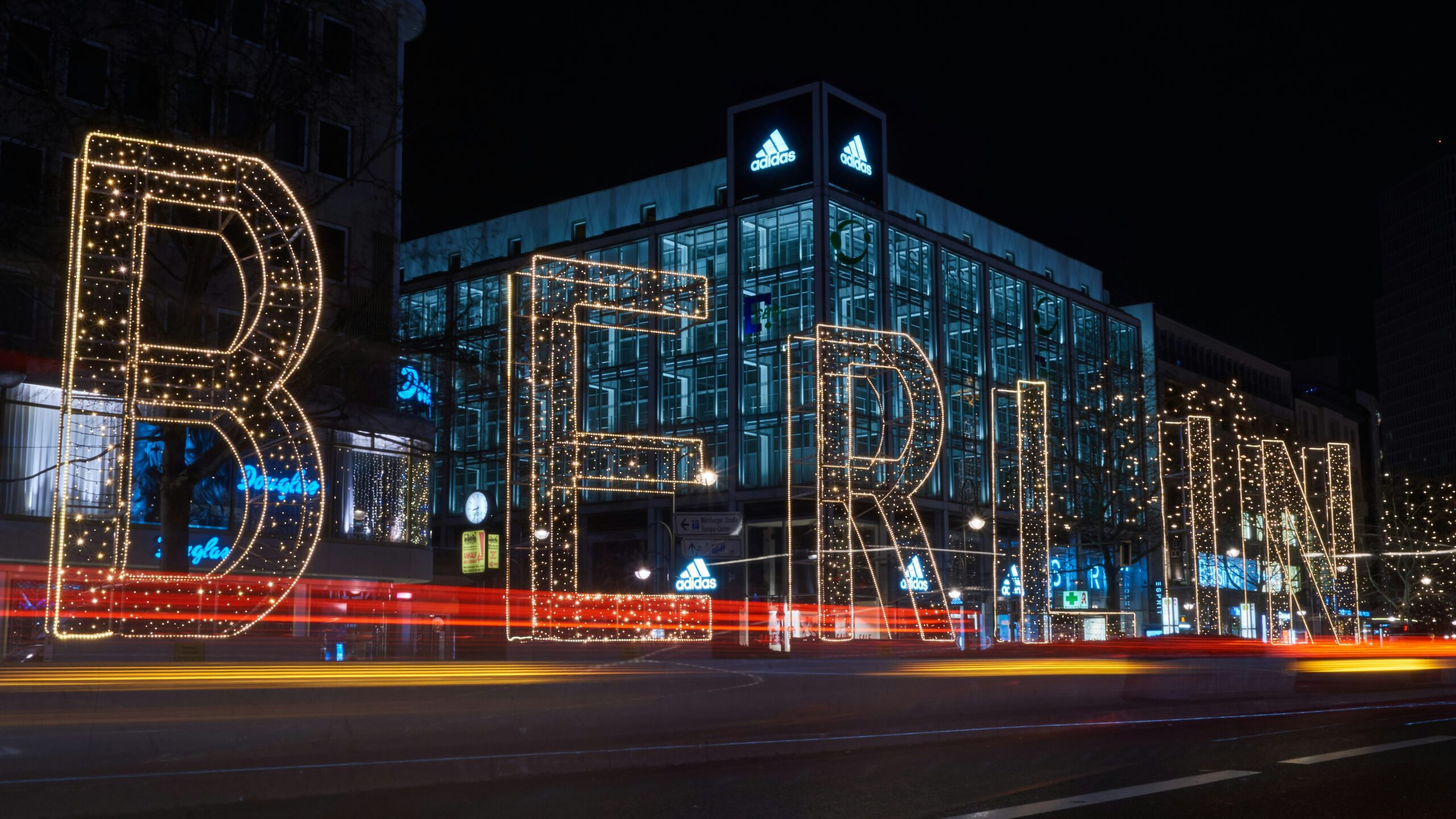 Berlin light up sign in front a building in the city