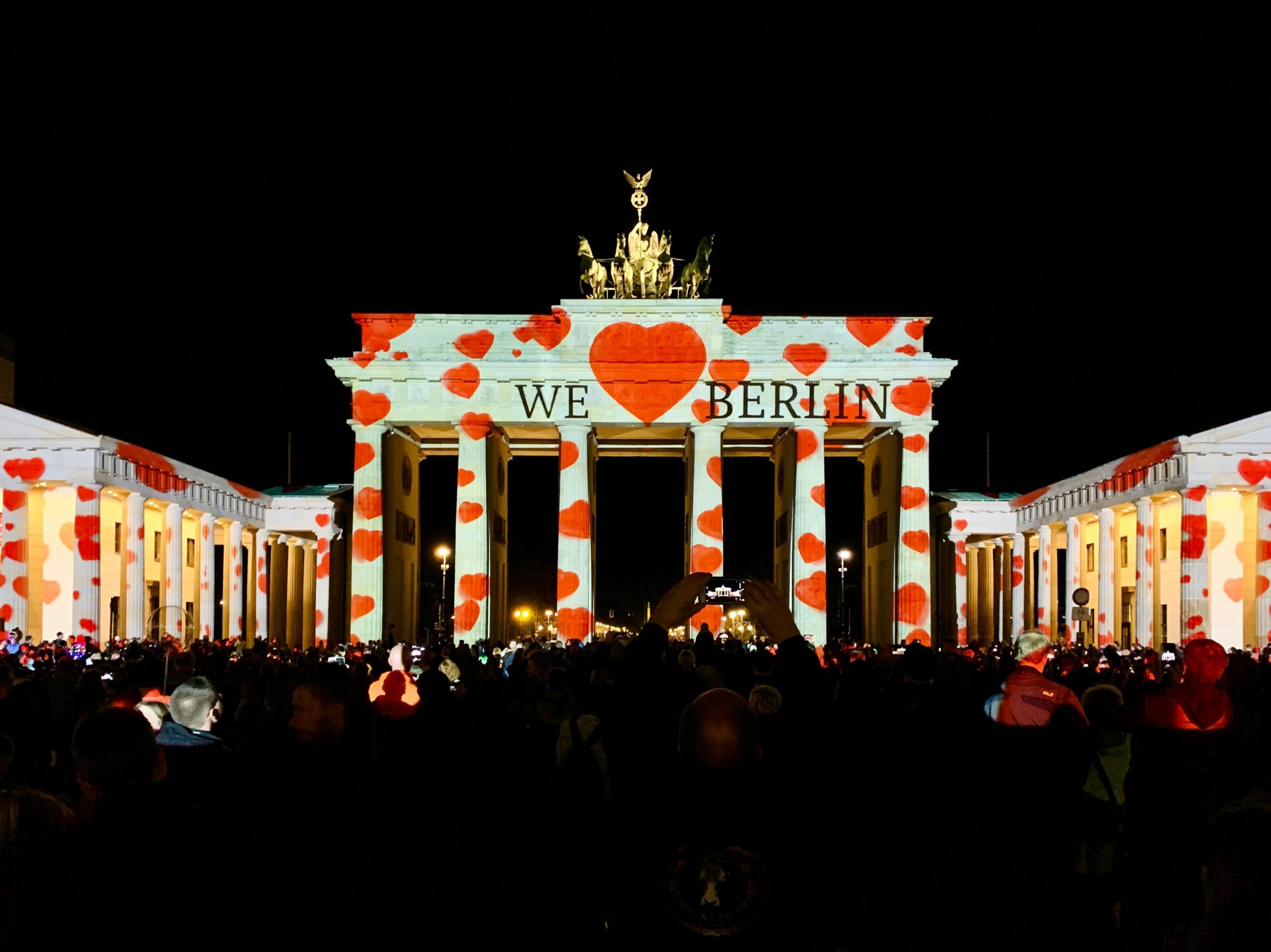 red hearts projected on Berlin pillar sign