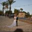 Bride and groom on the steps in Malta at golden hour.