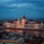 The grand Hungarian Parliament Building dominating the city skyline at night