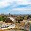 Private airport transfer in Barcelona with a panoramic view of Park Güell mosaics and the city skyline