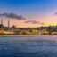 Private airport transfer in Istanbul with views of the Golden Horn and historic mosques at dusk