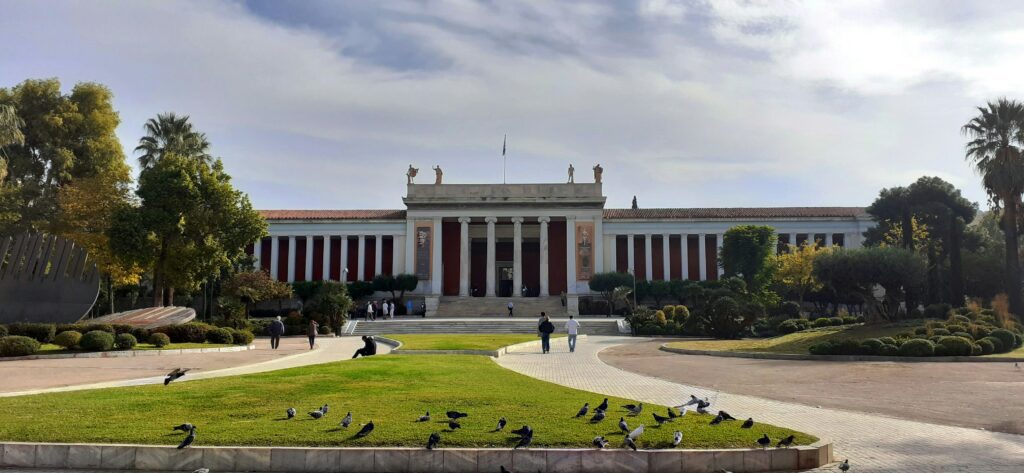 Neoclassical building facade in central Athens, Greece, under a clear blue sky.
