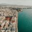 Stunning aerial view of the Thessaloniki waterfront and city skyline, perfect for travelers booking a reliable Thessaloniki airport taxi transfer to the city center.