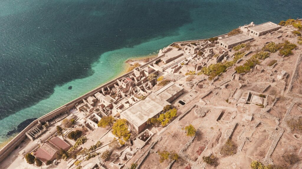 Aerial view of the ruined Venetian fortress and former leper colony on Spinalonga island, Crete